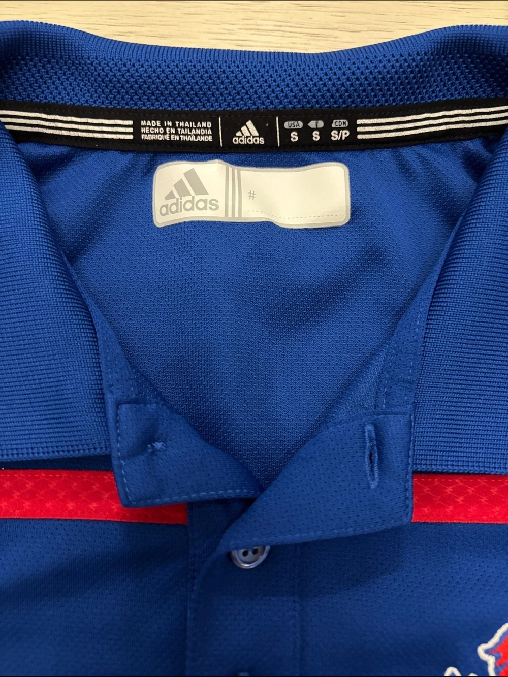 Adidas Kansas Jayhawks (KU) performance polo shirt in men’s size Small.